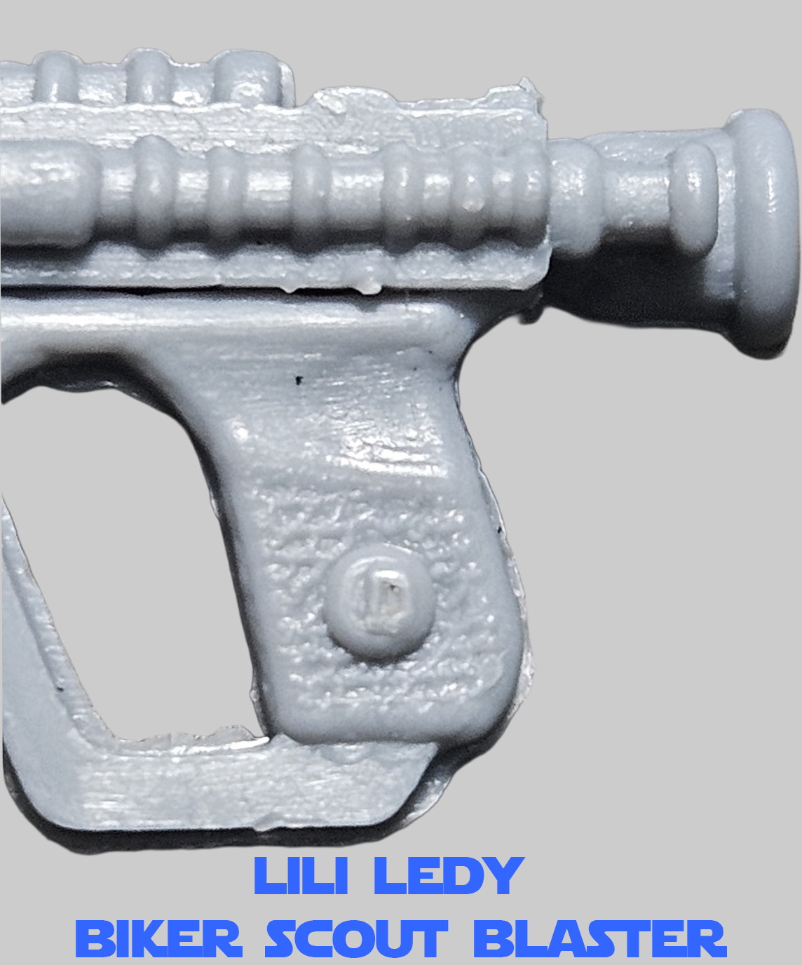 A true Lili Ledy Biker Scout will have a blaster with a D printed on the button of the grip.